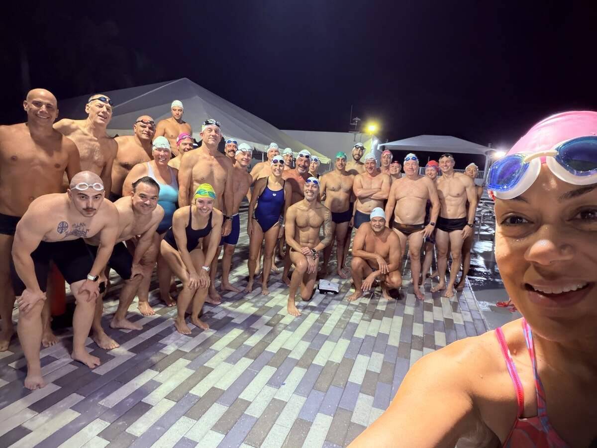 Vianney De Los Angeles takes a selfie with fellow Gulliver Masters, whom she rallied to raise $2,000 for the American Cancer Society in July by swimming 5 miles in a week’s time.